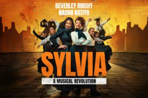 Poster for a musical titled 'Sylvia: A Musical Revolution' featuring Beverley Knight and Naomi Katiyo, with a diverse group of performers in period costumes against an orange cityscape backdrop.
