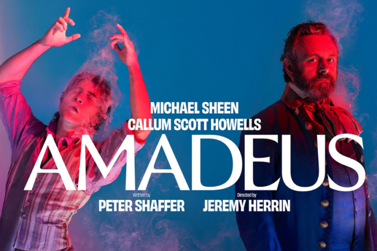 Promotional Amadeus poster with Michael Sheen and Callum Scott Howells, large AMADEUS title across a blue-red background with smoke effects.