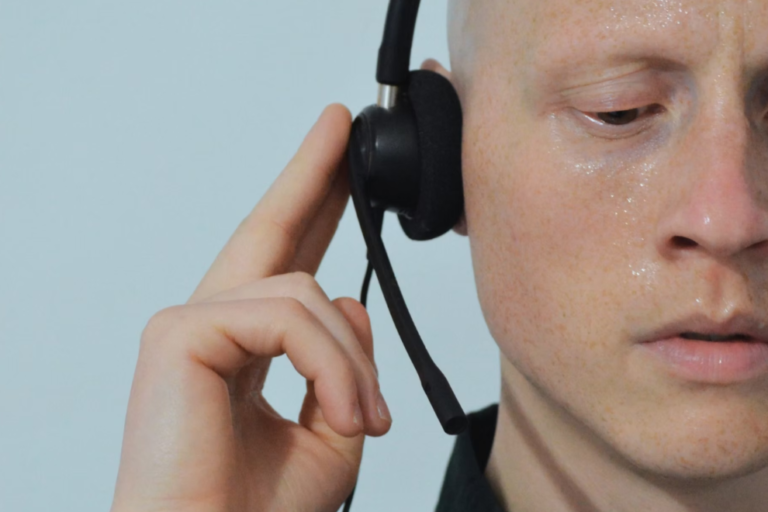 Close up image of a man wearing a head set