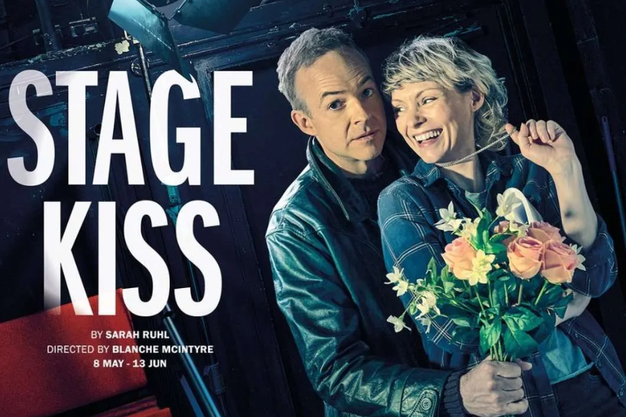 Poster for the stage play Stage Kiss with two smiling actors embracing; the woman holds a bouquet of flowers and the bold STAGE KISS title appears beside them.