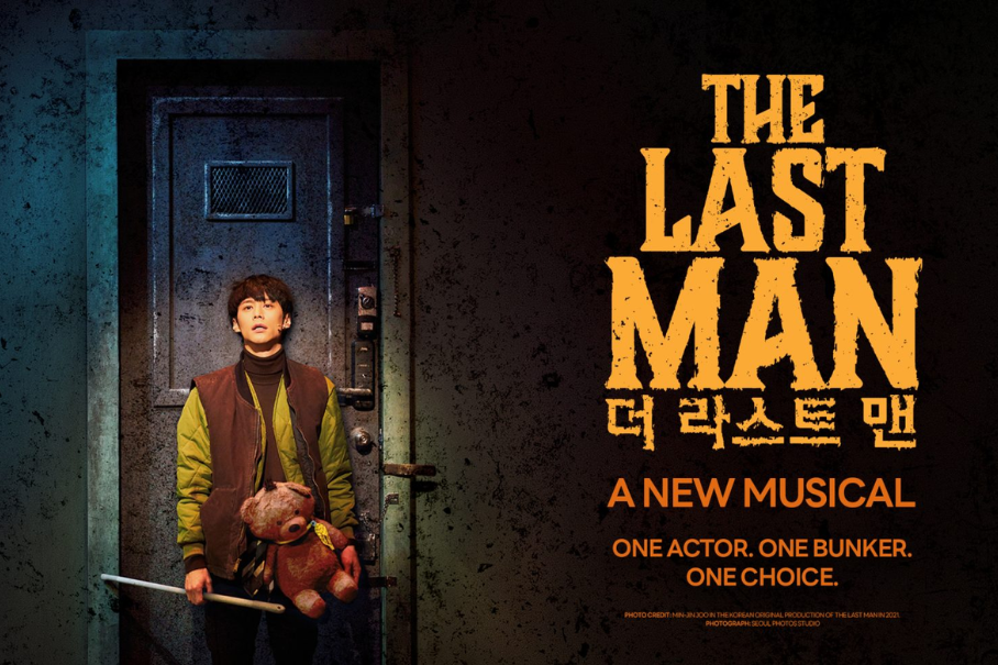 Poster for The Last Man: a young person in a green jacket stands by a metal door, holding a teddy bear and a stick; bold orange title text on the right reads 'The Last Man' with 'A New Musical' beneath.