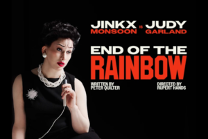 Promotional poster for End of the Rainbow featuring a woman in a black dress with pearls holding a microphone against a black background, text reads End of the Rainbow and Jinkx Monsoon as Judy Garland.