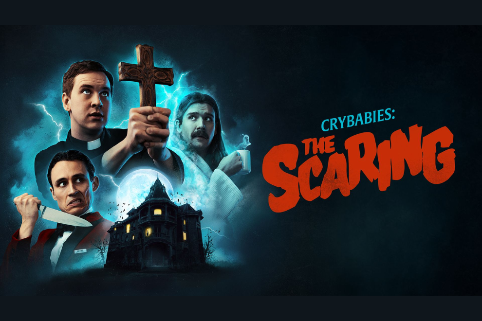 Promotional poster for Crybabies: The Scaring showing three men, a glowing cross, a haunted house, and a bold red title in orange tones.
