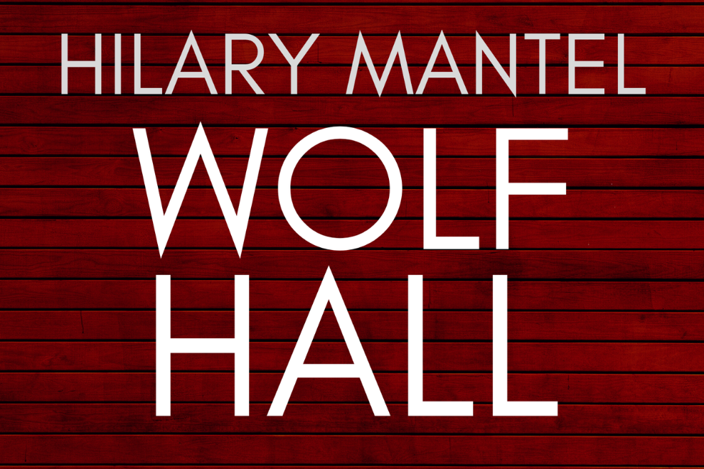 Book cover for Hilary Mantel's Wolf Hall with white title text on a red wooden background, large 'WOLF HALL' centerpiece.
