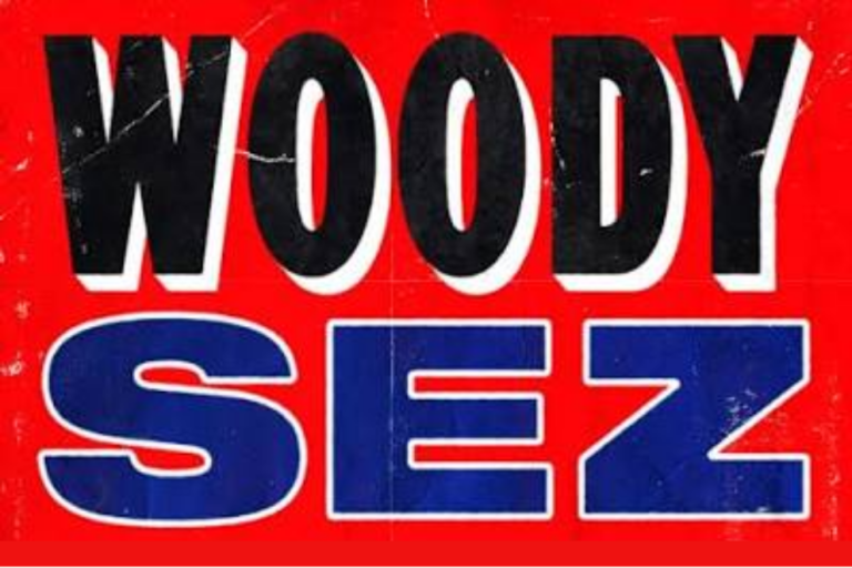 Red poster with large 'WOODY' in black outline above blue 'SEZ' lettering on a bold red background.